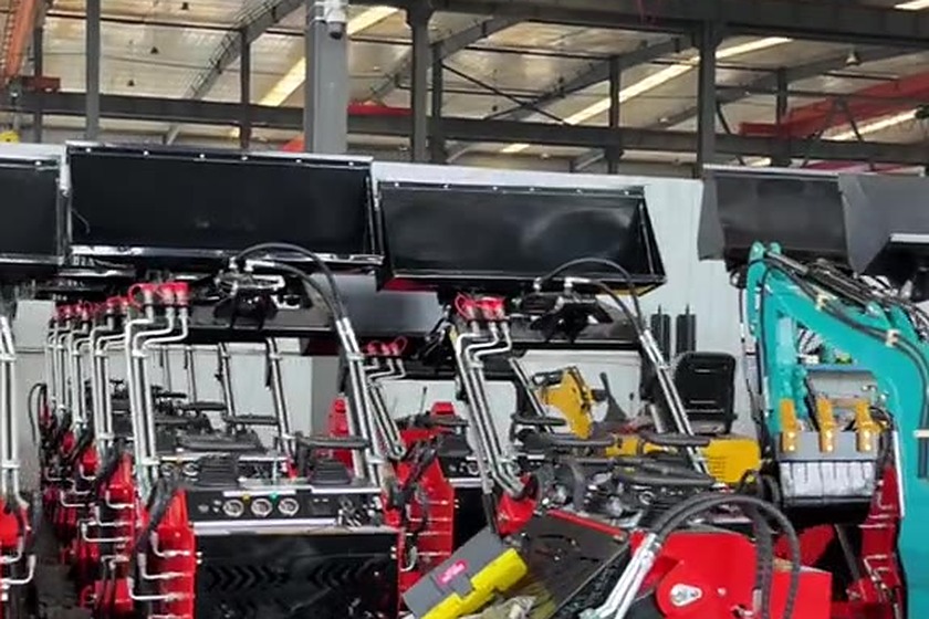 Skid steer loaders in build inside a workshop